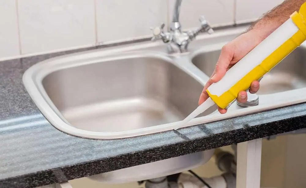 Which joints need to be sealed when setting up a sink